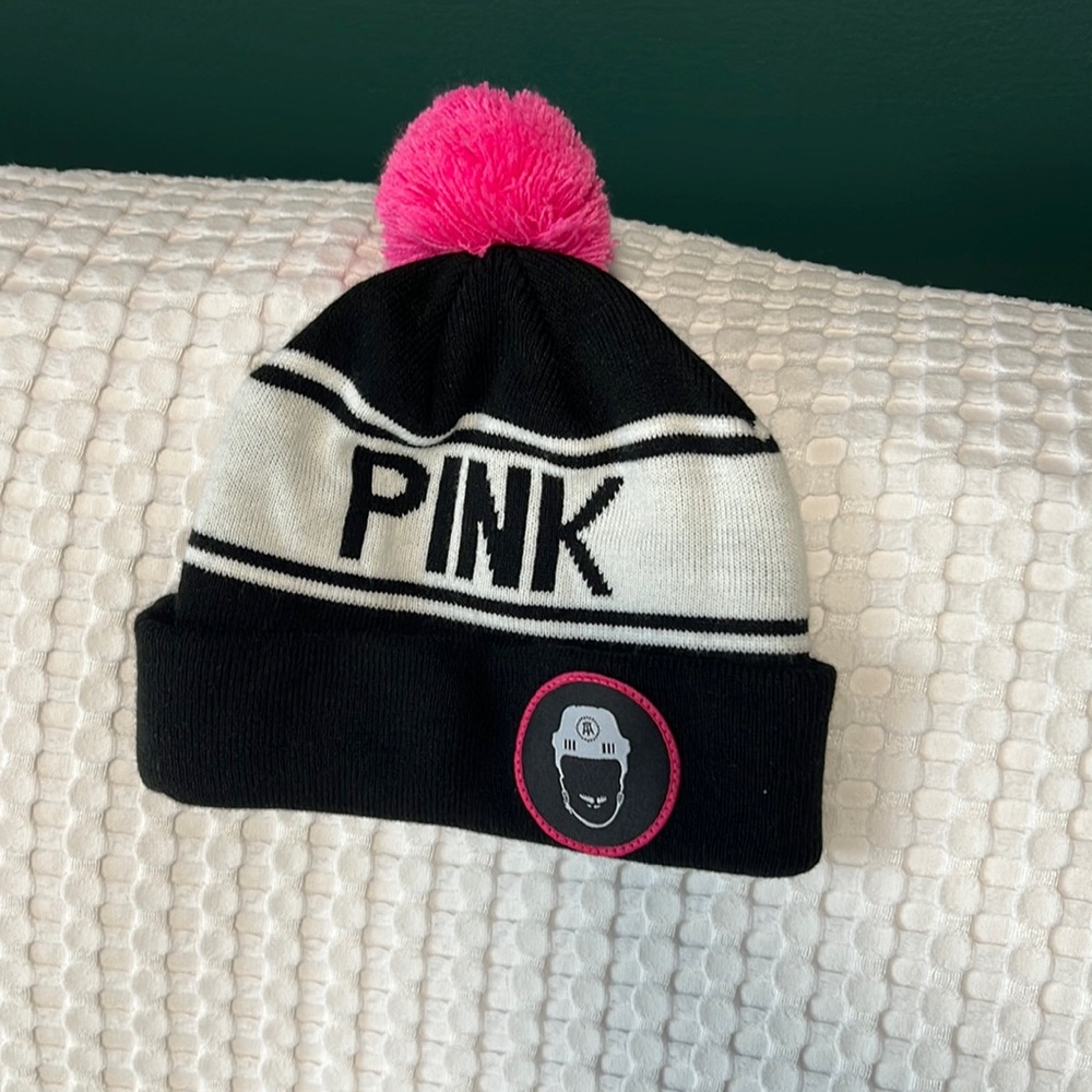 Barstool sports Pink Whitney Pom beanie. “Spittin’ chiclets” logo on the front.